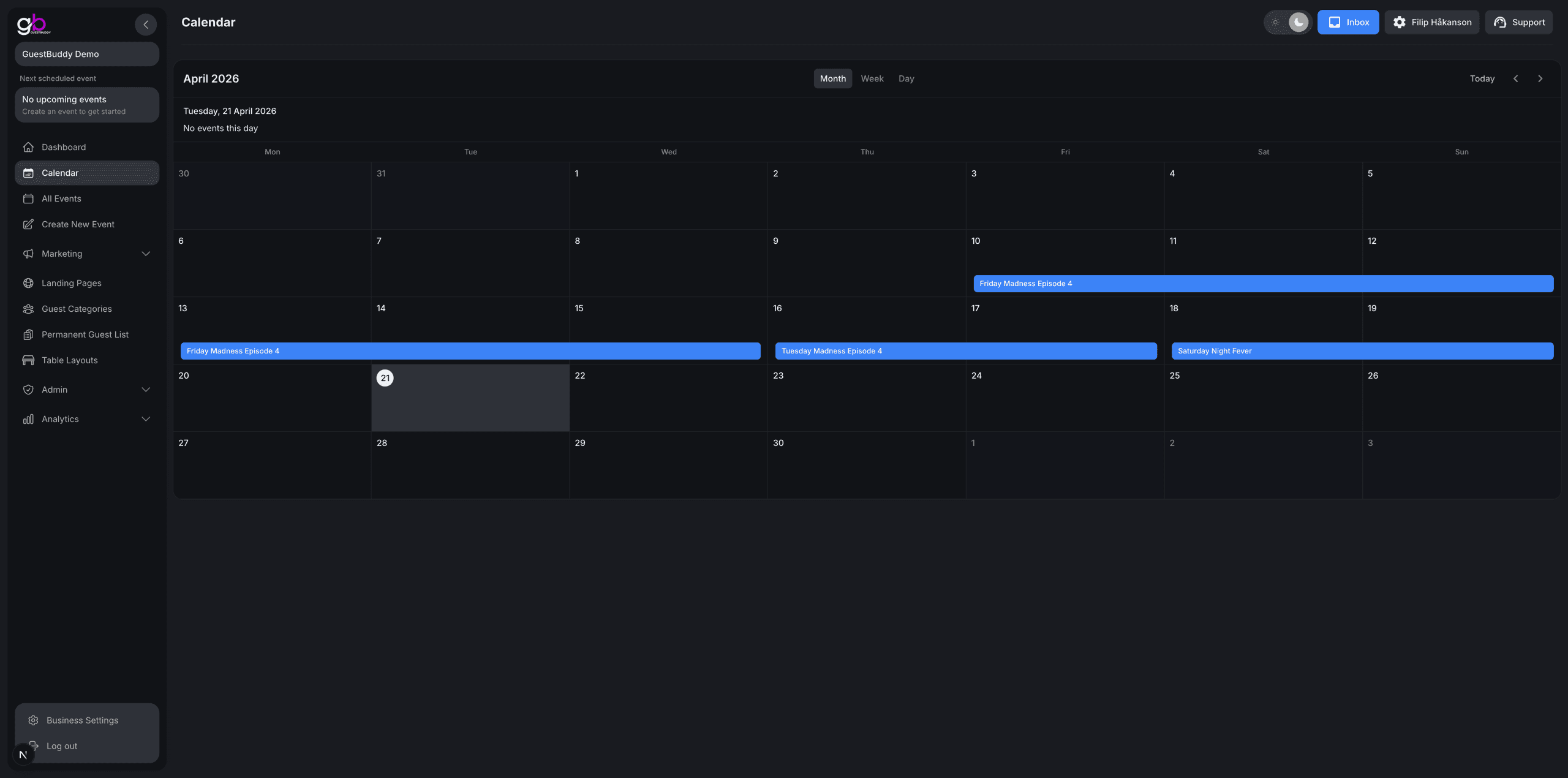 GuestBuddy calendar view with month grid and events